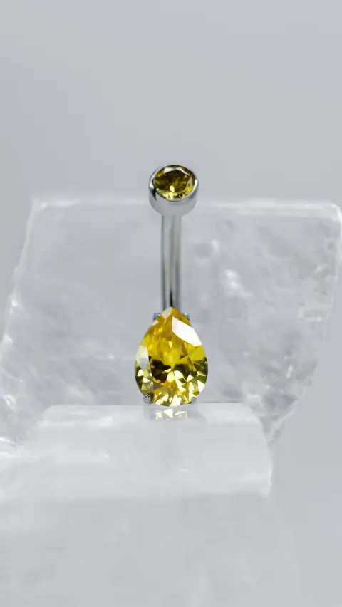 Tytanowy kolczyk do pępka 'crystal drop yellow'