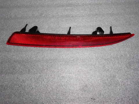 Odblask lewy zderzaka tylnego Opel Astra J