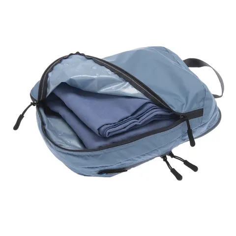 Organizer podróżny z dwiema przegrodami Cocoon Two-in-One Separated Packing Cube Light ash blue M 25 x 18 x 9 cm